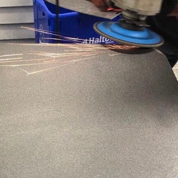 Raw steel plate being processed at the Steel Craft workshop